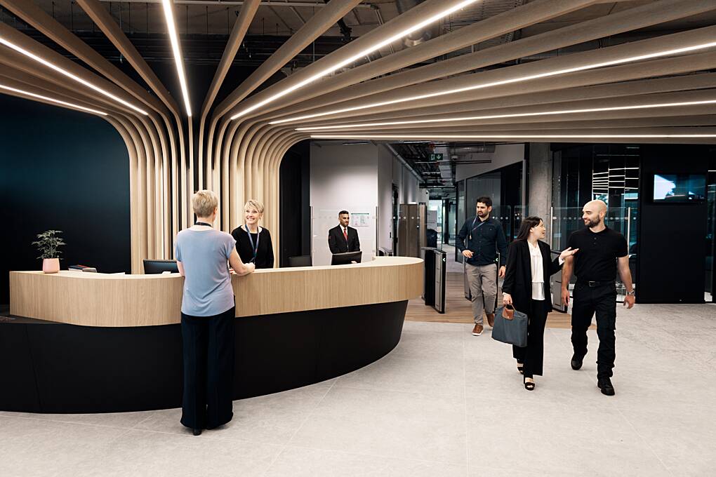 Busy client reception area with Securitas STARS officers on duty.